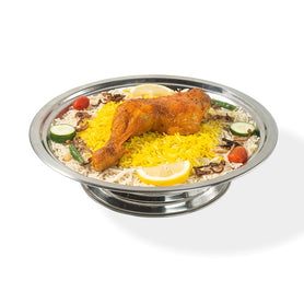 Abu Mubarak Chicken Mandi for one person, featuring a golden-brown roasted quarter-chicken on a bed of yellow and white aromatic smoked basmati rice, garnished with lemon, cucumber, and cherry tomatoes on a silver platter.
