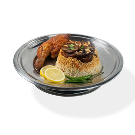 Abu Mubarak Chicken Maqlubah for one person, featuring a golden roasted quarter-chicken and crispy fries on a bed of aromatic spiced basmati rice, garnished with lemon and fresh vegetables.
