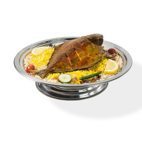 Abu Mubarak Fish Mandi for one person, featuring a whole golden-brown seasoned fish on a bed of yellow and white aromatic smoked basmati rice, garnished with lemon, cucumber, and a green chili on a silver platter.
