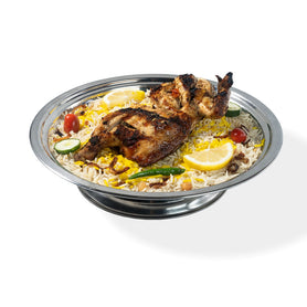 Abu Mubarak Grilled Chicken Mandi featuring a spice-marinated, flame-grilled quarter-chicken on a bed of aromatic yellow and white smoked basmati rice, garnished with lemon, cucumber, and cherry tomatoes on a silver platter.

